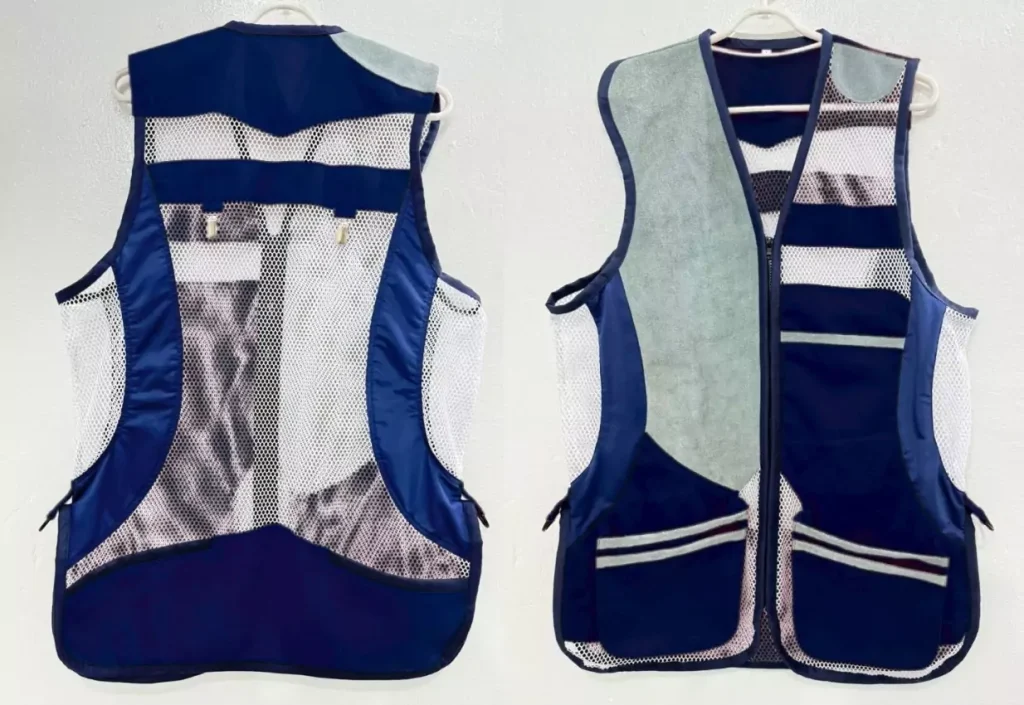 Front and back views of Roar Sporting's blue and grey shooting jacket, showcasing its design for enhanced performance and comfort.